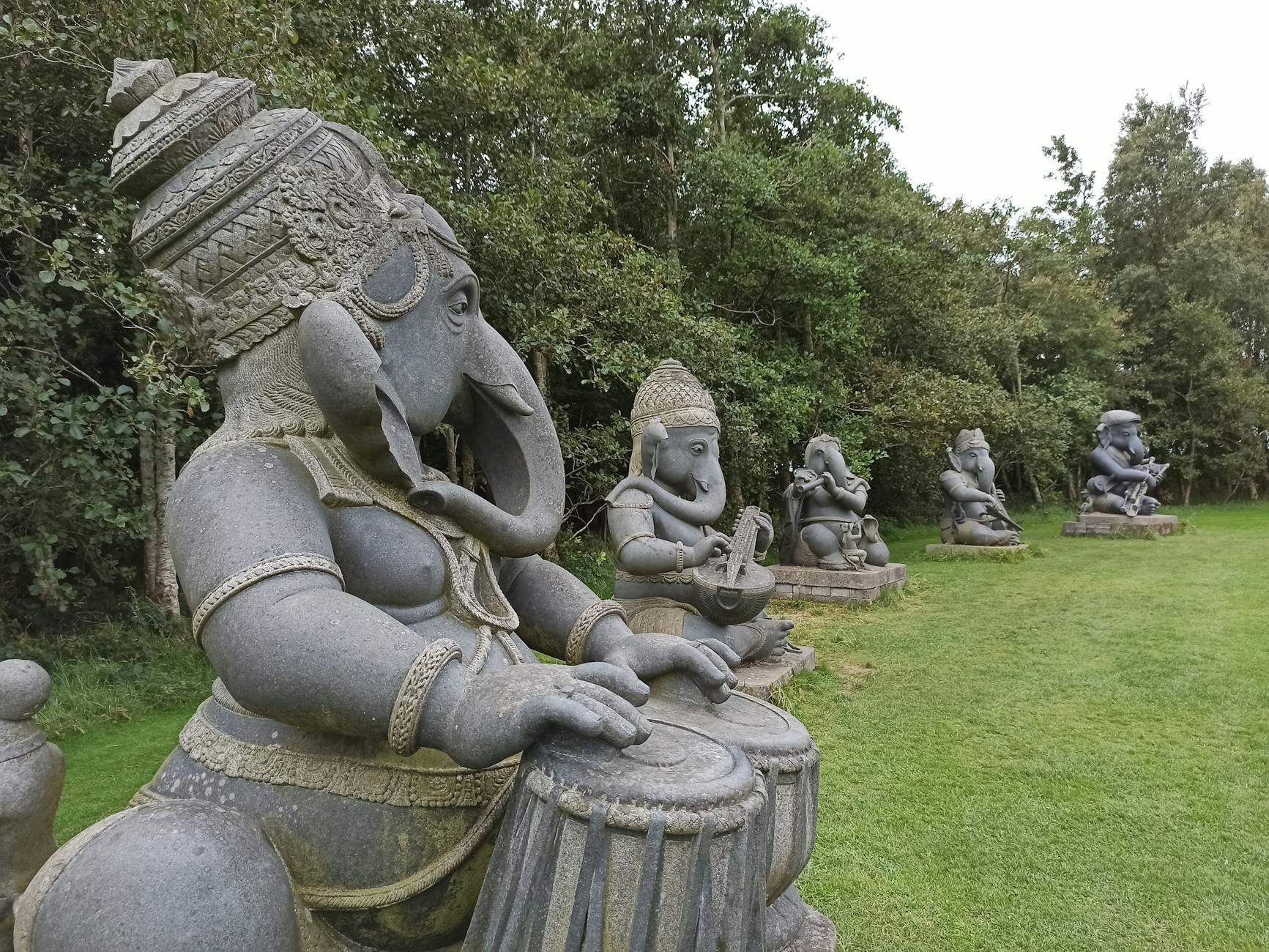 elephant statues on green grass